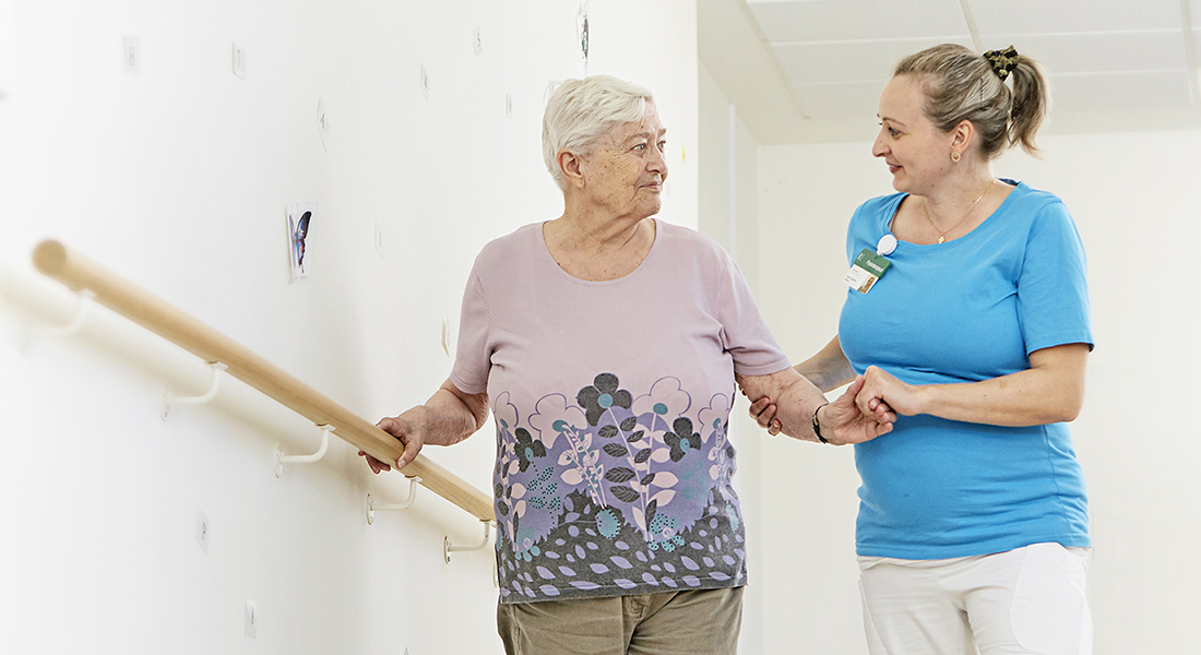 Patient and nurse during walking exercise